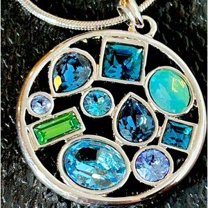 Touchstone Crystal Swarovski Crystals with rhodium. Doesn’t tarnish or fade.